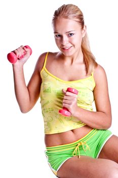 pink dumbbells in the hands of women on a white background