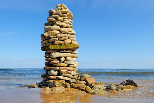 Stout pile of boulders on the sea shore