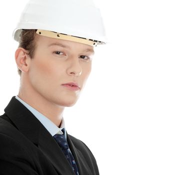 Young engineer in helmet, isolated over white