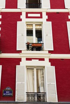 Several French Windows on a Brick Wall