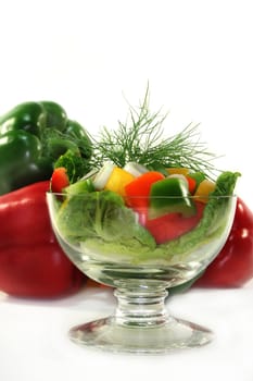 colorful bell pepper salad with dill in small glass bowl