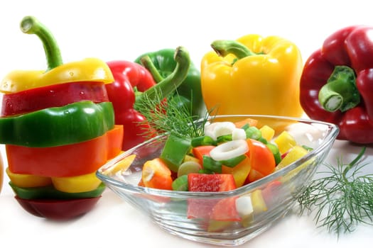 colorful bell pepper salad with dill in small glass bowl