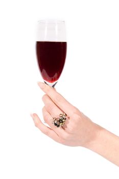 Woman hand with ring holding glass of wine on white