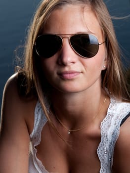 portrait of a young blonde woman with sunglasses