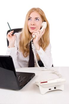 Businesswoman talking on telephone with laptop over white