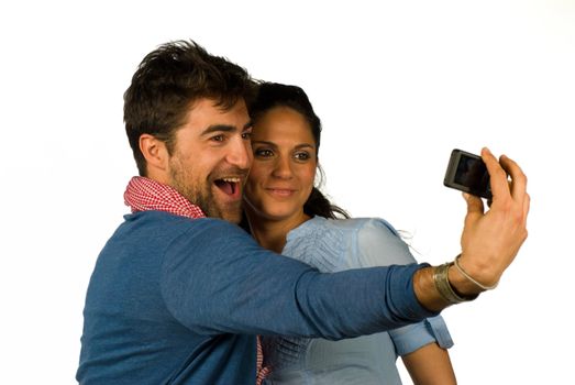 Happy loving couple having fun taking photos of themselves