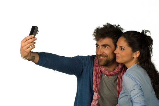 Happy loving couple having fun taking photos of themselves