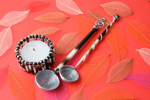 Ethnic Olive Spoons on a leafy red background