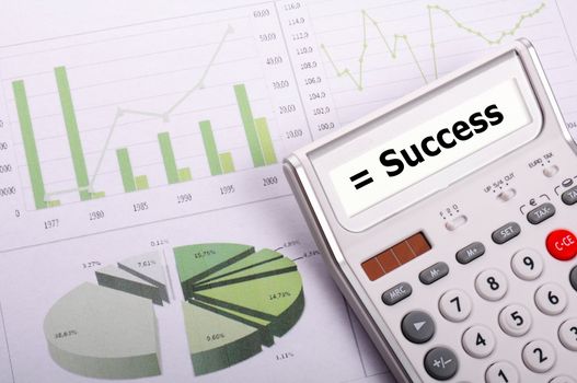success concept with word on business calculator