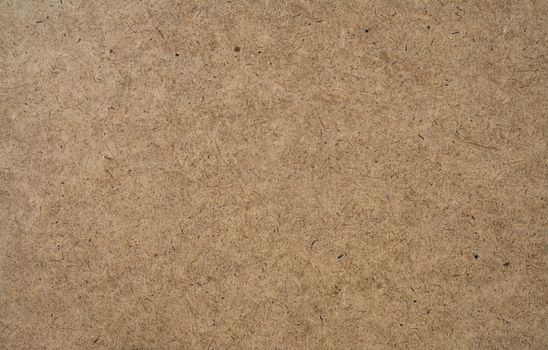 A texture of hardboard or masonite, the material often used for pegboard.