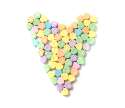 A heart made up of multi colored candy hearts