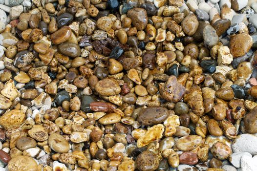 An oil spill pollutes some pristine rocks