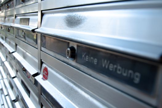 Rows of letterboxes with German "Keine Werbung" (no junkmail) labels