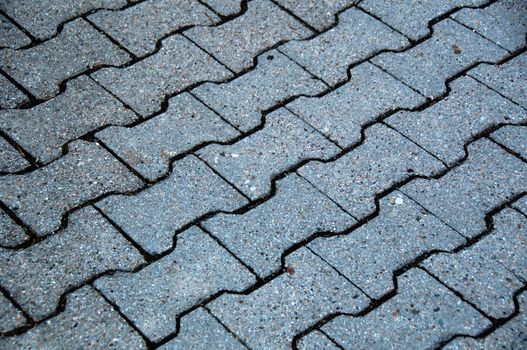 Bone Shaped Cobblestone Tiles On The Floor In Prespective