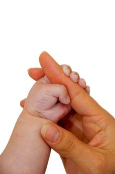 Baby and mother are holding hands. Taken on a clean white background.