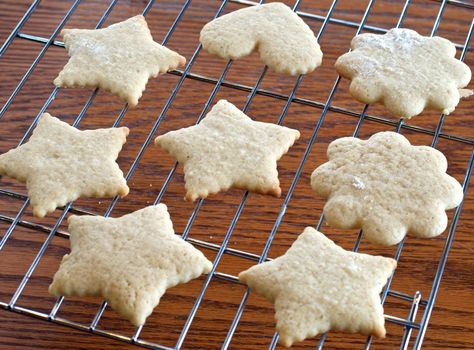 Cutout Christmas cookies cooling on a rack