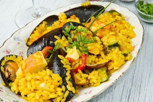 Close-up of Spanish paella on white plate