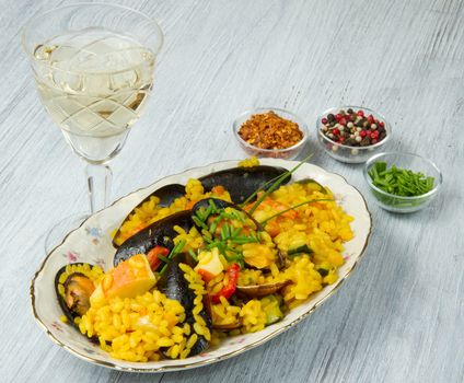 Close-up of Spanish paella on white plate