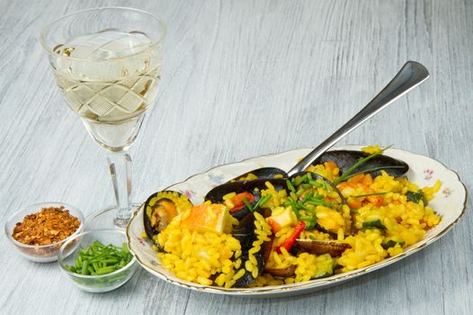 Close-up of Spanish paella on white plate