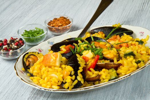 Close-up of Spanish paella on white plate