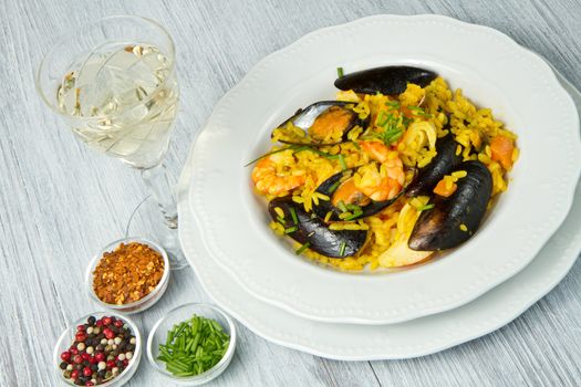 Close-up of Spanish paella on white plate