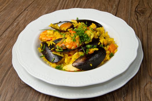 Close-up of Spanish paella on white plate