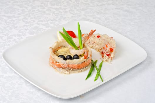 tasty prepared fish with rice and vegetables