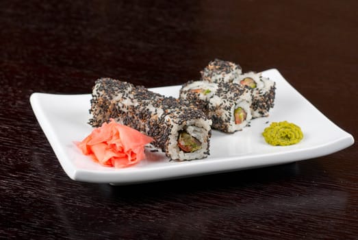 Closeup of Sushi rolls at plate with sesame