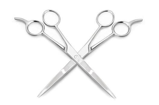Two stainless steel hairdressing scissors overlapping each other against a white background