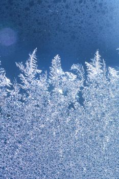 The patterns made by the frost on the window (hoarfrost background)