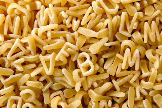 Kids soup letters pasta. Italian food background.