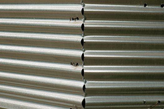 Corrugated sheet metal fence. Abstract industrial background.