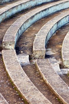 Empty amphitheater stone seats pattern. Abstract background.