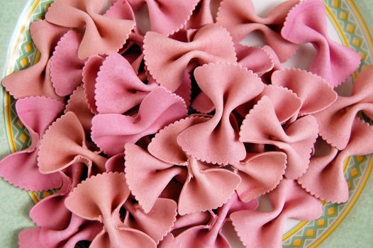 Raw farfalle bow ties pasta. Italian food backgrround.