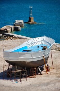 Fishing boat being repaired at a shipyard in the harbor of Zakynthos, Greece.