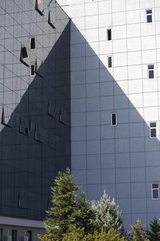 Modern architecture. Glass office buildings cast shadow.