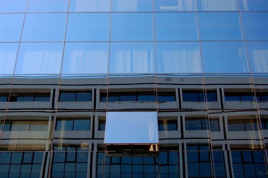 Modern glass building with open window. Abstract architecture background.