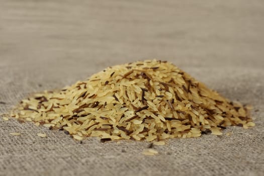 wild rice grains, close-up, on a textile background