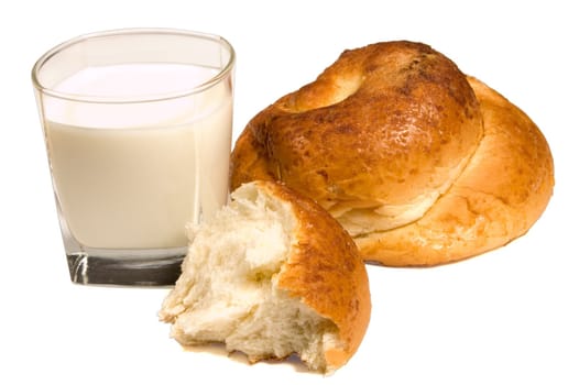 Glass of milk and white pastry isolated