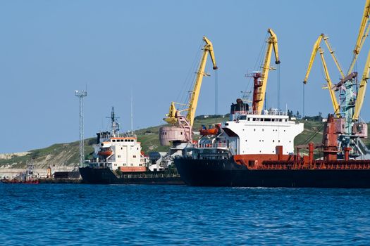 Ships being unloaded by cranes at the port