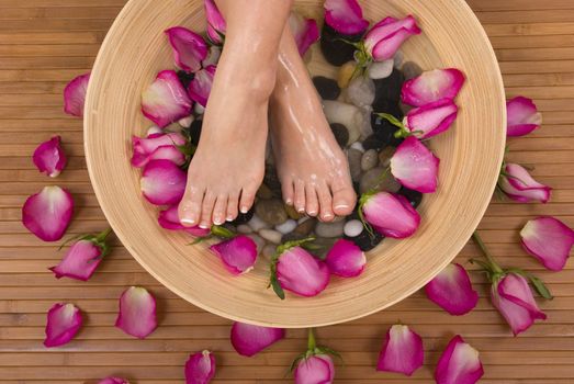 Being pampered by beautiful aromatic pink roses and therapeutic mineral water bath