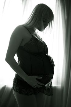 The pregnant woman on the ninth month. The child will be born one of these days
