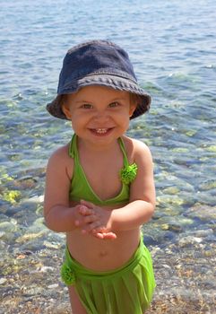 A very cute little girl with beautiful smile at the beach