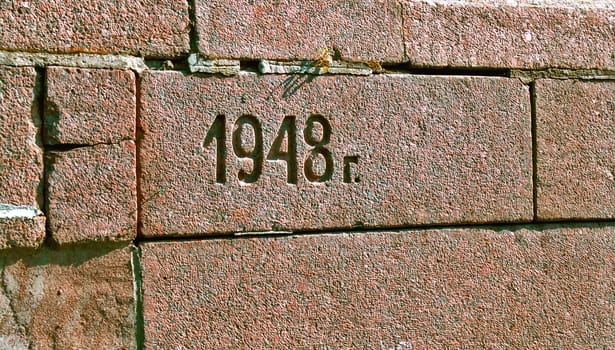 Engraving stone of the wall with the mark of 1948 year
