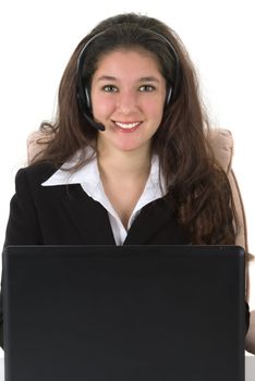 Beautiful professionally dressed businesswoman with her headset and computer