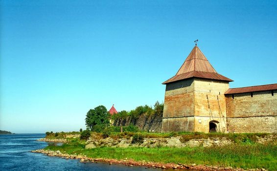 Ancient fortress with the tower near the river