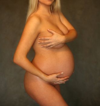 The pregnant woman on the ninth month. The child will be born one of these days