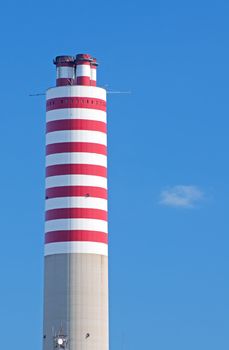 High striped red and white chimney stack of a power plant