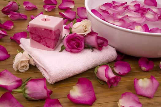 Spa Treatment with aromatic roses, petals, and candle