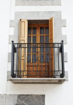 The Renovated Facade of the Old Spanish House with Balcony